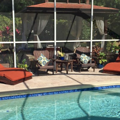 Penny Wooden Sun Lounger (Options: Honeymoon, Standard 72", Redwood, No Snack Trays, 13" H, No Wheels, 3" thick Cushion, 5 Section Cushion, Coffee-Stain Premium Sealant). Photo Courtesy of Mark and Dorit Stone of Odessa, Florida.