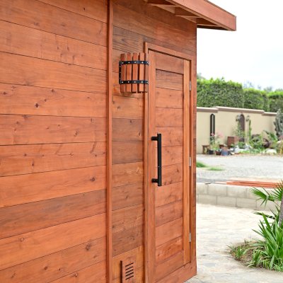 Raul’s Rad Redwood Sauna (Options: 11' W, 8' D, 11' H, California Redwood (for Interiors) & Mature Redwood (for Exteriors), Pitch Roof for Exterior Areas, "L" Shape Bench (2 levels), Transparent Premium Sealant).