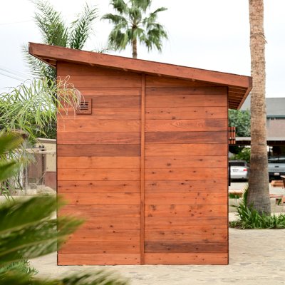 Raul’s Rad Redwood Sauna (Options: 11' W, 8' D, 11' H, California Redwood (for Interiors) & Mature Redwood (for Exteriors), Pitch Roof for Exterior Areas, "L" Shape Bench (2 levels), Transparent Premium Sealant).