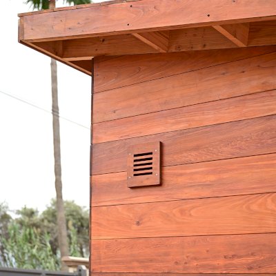 Raul’s Rad Redwood Sauna (Options: 11' W, 8' D, 11' H, California Redwood (for Interiors) & Mature Redwood (for Exteriors), Pitch Roof for Exterior Areas, "L" Shape Bench (2 levels), Transparent Premium Sealant).