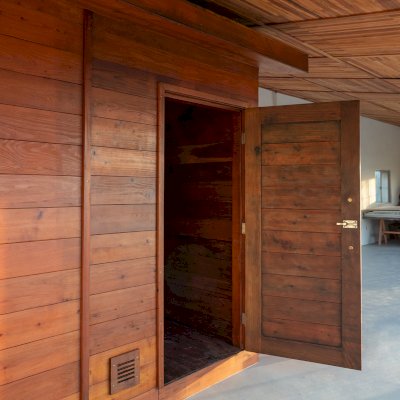 Raul’s Rad Redwood Sauna (Options: 11' W, 8' D, 11' H, California Redwood (for Interiors) & Mature Redwood (for Exteriors), Pitch Roof for Exterior Areas, "L" Shape Bench (2 levels), Transparent Premium Sealant).