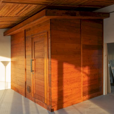Raul’s Rad Redwood Sauna (Options: 11' W, 8' D, 11' H, California Redwood (for Interiors) & Mature Redwood (for Exteriors), Pitch Roof for Exterior Areas, "L" Shape Bench (2 levels), Transparent Premium Sealant).