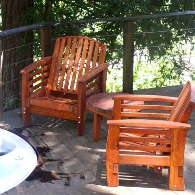 Reclining Redwood Easy Chairs (Options: Mature Redwood, No Cushion, Transparent Premium Sealant). Photo also shows a Round Side Table.