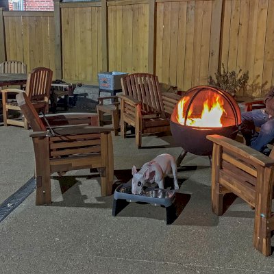 4 Reclining Redwood Easy Chairs (Options: Mosaic Redwood, No Cushion, No Ottoman, Transparent Premium Sealant). A Lisa's Retro Outdoor Patio Table Set with Chairs Shown in Background. 