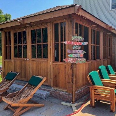 3 Reclining Redwood Easy Chairs (Options: Mosaic Redwood, With Cushion, No Ottoman, Transparent Premium Sealant). Photo Also Shows 2 Rio Hammock Chairs and a Spa Gazebo Kit. Photo Courtesy of J. Zawalski of Groveland, Massachusetts.