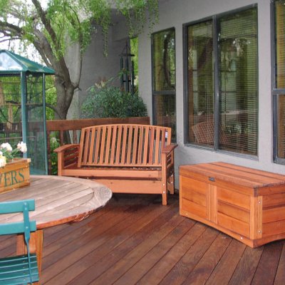 Reclining Redwood Loveseat (Options: Old-Growth Redwood, No Cushion, Transparent Premium Sealant). Photo also shows a custom Alan's Storage Bench.