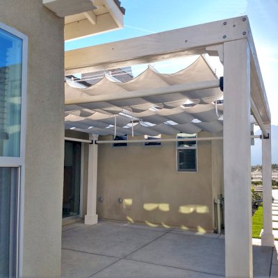 Retractable Canopy Pergola (Options: 16' L x 15' W, No Privacy Panel, Douglas-Fir, 9.5 ft Post Height, 1 Electrical Wiring Trim, Post Anchor Kit for Concrete, No Post Decorative Trim, 1 Ceiling Fan Base, 4 Curtain Rods, Off-White Oil-Based Primer). Photo Courtesy of M. Tiffany of Palm Springs , CA.