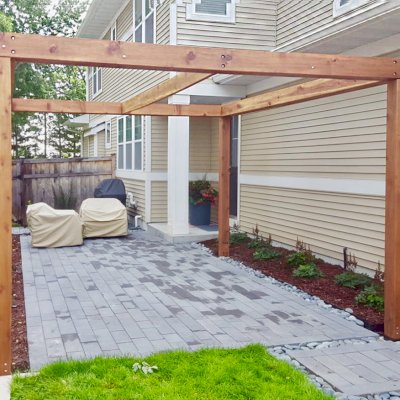 Retractable Canopy Pergola (Options: 14' L x 12' W, No Privacy Panel, California Redwood, 9 ft Post Height, No Electrical Wiring Trim, Replaced Our Anchor Kit with a Knife Plate Connector System to Achieve a More Modern Way to Attach the Posts, No Post Decorative Trim, No Ceiling Fan Base, No Curtain Rods, Transparent Premium Sealant). Photo Courtesy of B. Sill of Edina, Minnesota.