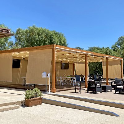 Retractable Canopy Pergola (Options: 24' W x 40' L, Douglas-fir, 8-Post Anchor Kit for Concrete, Transparent Premium Sealant). Photo Courtesy of El Paseo Tennis Club of Valencia, CA.