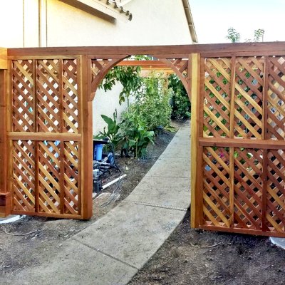 Custom Retractable Canopy Pergola (Options: 23' L x 12.5' W, Custom Lattice Entryway, California Redwood, 8.5 ft Post Height, No Electrical Wiring Trim, No Ceiling Fan Base, No Curtain Rods, Post Anchor Kit for Concrete, Transparent Premium Sealant). Photo Courtesy of D. Morris of Phoenix, Arizona.