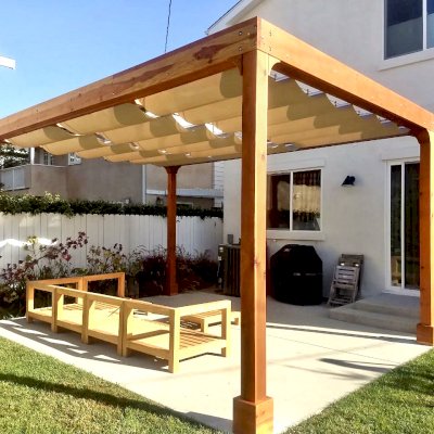 Retractable Canopy Pergola (Options: 18' L x 14' W, No Privacy Panel, California Redwood, 10' Post Height, 1 Electrical Wiring Trim, 4-Post Anchor Kit for Concrete, No Post Decorative Trim, No Ceiling Fan Base, No Curtain Rods Transparent Premium Sealant). Photo Courtesy of D. Evans of Los Angeles, California.