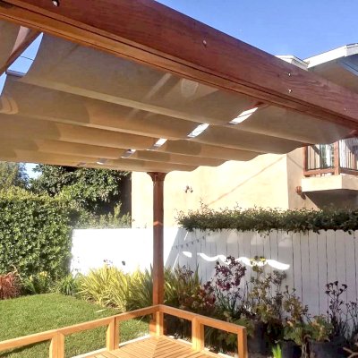 Retractable Canopy Pergola (Options: 18' L x 14' W, No Privacy Panel, California Redwood, 10' Post Height, 1 Electrical Wiring Trim, 4-Post Anchor Kit for Concrete, No Post Decorative Trim, No Ceiling Fan Base, No Curtain Rods Transparent Premium Sealant). Photo Courtesy of D. Evans of Los Angeles, California.