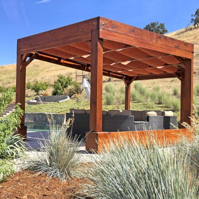 Custom Retractable Canopy Pergola (Options: 20' x 12', Mature Redwood, Posts Anchor Kit for High-Wind, Extra Thick Lumber by Custom Request, Transparent Premium Sealant). Retractable Shade Canopies Added by the Customer. Photo Courtesy of D. Ruprecht of Hollister, CA.