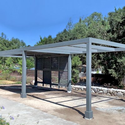 Custom Retractable Canopy Pergola (Options: 40' L x 14' W, 1 Privacy Panel Louvered, Douglas-fir, With Louvered Panels in the Center Section of the Roof, 10 ft Post Height, 8-Post Anchor Kit for Concrete, No Electrical Wiring Trim, No Post Decorative Trim, No Ceiling Fan Base, No Curtain Rods, with Gray Primer). Photo Courtesy of R. Clark of Carmel Valley, California.