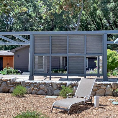 Custom Retractable Canopy Pergola (Options: 40' L x 14' W, 1 Privacy Panel Louvered, Douglas-fir, With Louvered Panels in the Center Section of the Roof, 10 ft Post Height, 8-Post Anchor Kit for Concrete, No Electrical Wiring Trim, No Post Decorative Trim, No Ceiling Fan Base, No Curtain Rods, with Gray Primer). Photo Courtesy of R. Clark of Carmel Valley, California.