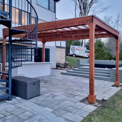 Retractable Canopy Pergola (Options: 20' L x 12' W, No Privacy Panel, California Redwood, 10 ft Post Height, No Electrical Wiring Trim, 2 Ceiling Fan Bases & 3 Accessory Bases, No Post Decorative Trim, with Rain Guard, No Curtain Rods, Transparent Premium Sealant). Photo Courtesy of T. Booher of Chagrin Falls, OH.