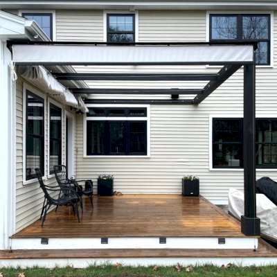 Retractable Canopy Pergola (Options: 14' x 12', California Redwood, No Ceiling Fan Base, 9' Posts, No Electrical Wiring Trim Kit, 1-Post Anchor Kit for Wood, Black Stain Premium Sealant). Photo Courtesy of Y. Sarafinas of Windham, New Hampshire.