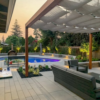 Retractable Canopy Pergola (Options: 17' L x 16' W, No Privacy Panel, California Redwood, 9.5 ft Post Height, No Electrical Wiring Trim, Replaced Our Anchor Kit with a Knife Plate Connector System to Achieve a More Modern Way to Attach the Posts, No Post Decorative Trim, No Ceiling Fan Base, No Curtain Rods, Transparent Premium Sealant). Photo Courtesy of P. Moran of San Jose, CA.
