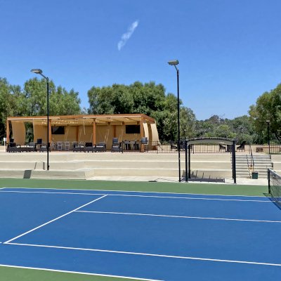 Retractable Canopy Pergola (Options: 24' W x 40' L, Douglas-fir, 8-Post Anchor Kit for Concrete, Transparent Premium Sealant). Photo Courtesy of El Paseo Tennis Club of Valencia, CA.