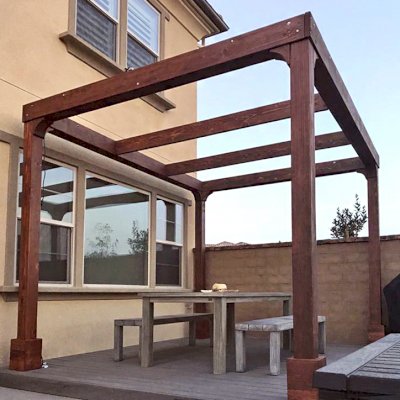 Retractable Canopy Pergola (Options: 14' L x 10' W, No Privacy Panel, California Redwood, 9ft Post Height, No Electrical Wiring Trim, 4-Post Anchor Kit for Concrete, No Post Decorative Trim, No Ceiling Fan Base, No Curtain Rods, Coffee-Stain Premium Sealant). Photo Courtesy of D. Kim of Rancho Mission Vieja, CA.