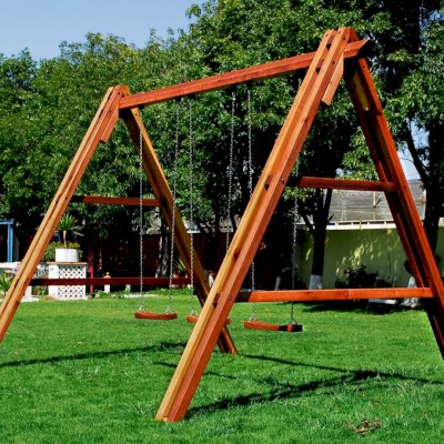 Rory's Giant Playground Swing Sets (Options: Mature Redwood, Standard Swing Seats, Transparent Premium Sealant). Photo shows swing before diagonal braces installation.