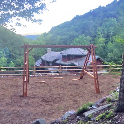 Rory's Giant Playground Swing Sets (Options: 3 Seats, Redwood, 3 Standard Swing Seats, Transparent Premium Sealant). Beam 20 ft wide instead of 17 ft by Custom Request. Photo Courtesy of Shimon Eckstein of West Shokan, NY.
