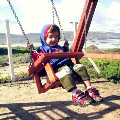 Toddler/Small Kid's Swing Seat - Mature Redwood This swing is being enjoyed by a three-year-old. Toddler swing seats can be used for kids up to age 5.