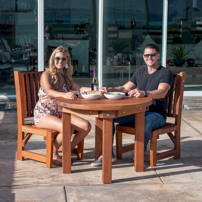 Round Outdoor Patio Table (Options: 3 1/2', 2 Chairs, Mature Redwood, Ruth Chairs, No Cushions, Side Chairs only (no arms), Standard Tabletop, No Lazy Susan, No Umbrella Hole, Transparent Premium Sealant).  Photo Courtesy of The Estero Beach Resort of Ensenada, Mexico. 