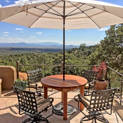 Round Outdoor Patio Table (Options: 4 ft, No Seating, Redwood, Standard Tabletop, No Lazy Susan, 1 5/8" Umbrella Hole, Transparent Premium Sealant). Phoro Courtesy of S. Strauch of Santa Fe, New Mexico.