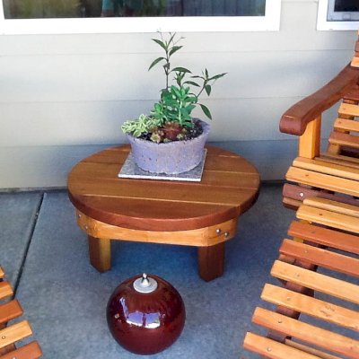Round Solid Wood Side Table (Options: 30", Redwood, Rounded Apron, 12 inches tall, Transparent Premium Sealant). Photo Courtesy of Marilyn B. of Star, Idaho.