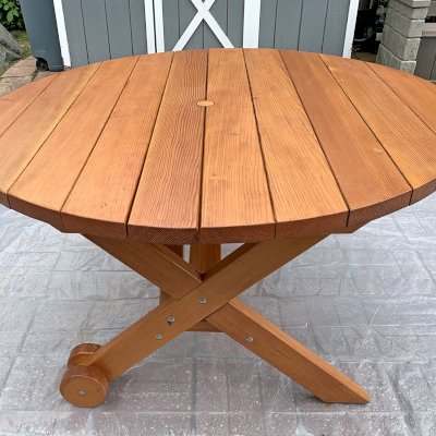 Round Wood Picnic Table with Wheels (Options: 5' Diameter, No Seating, Douglas-fir, Standard Tabletop, No Lazy Susan, 1-5/8in Umbrella Hole, Transparent Premium Sealant). Photo Taken After Clean and Touch Up the Table, One Year After Installation. Photo Courtesy of L. LaPorte of Lincoln Park, New Jersey.
