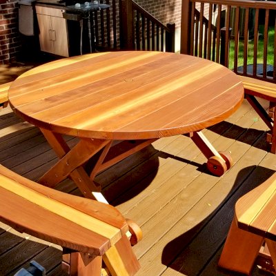 Round Wood Picnic Table with Wheels (Options: 5' Diameter, Unattached Benches, Redwood, Round Picnic Benches, Standard Tabletop, No Lazy Susan, 1 5/8" Umbrella Hole & Plug, Transparent Premium Sealant). Photo Courtesy of A. Adler of Hempstead, New York.