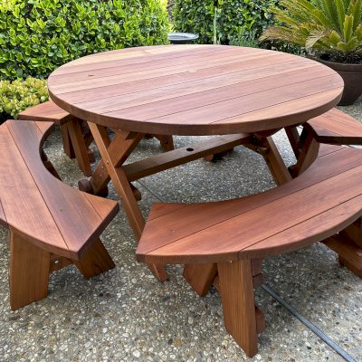 Round Wood Picnic Table with Wheels (Options: 4.5' Diameter, Arc Picnic Benches, Mature Redwood, Round Picnic Benches, Standard Tabletop, No Lazy Susan, 1 5/8" Umbrella Hole & Plug, Transparent Premium Sealant). Photo Courtesy of L. Moore of Santa Barbara, CA.