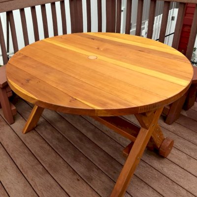 Round Wood Picnic Table with Wheels (Options: 4' Diameter, No Seating, Redwood, Standard Tabletop, No Lazy Susan, 2" Umbrella Hole, Transparent Premium Sealant). Photo Courtesy of L. Roberts of Hermosa Beach, CA.