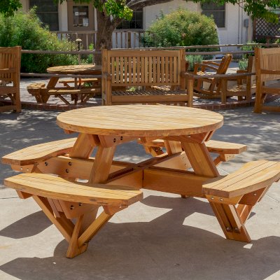 Round Wooden Picnic Table (Attached Benches) (Options: 4' Diameter, Attached Benches, Mosaic Douglas-Fir, Standard Tabletop, No Lazy Susan, No Umbrella Hole, Transparent Premium Sealant). Photo courtesy of Vanguard University [55 Fair Dr, Costa Mesa, CA].