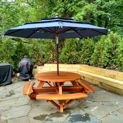 Round Wooden Picnic Tables (Attached Benches) (Options: 5' Diameter, Attached Benches, California Redwood, Standard Tabletop, No Lazy Susan, 1 5/8 Umbrella Hole & Plug, Transparent Premium Sealant). Photo Courtesy of S. Shilagani of Great Neck, New York.