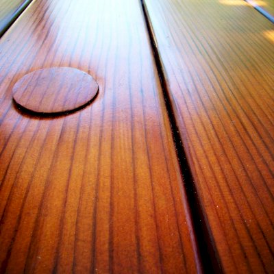 Closeup of tabletop highlighting the exquisite quality of the vertical grain lumber and the Transparent Premium Sealant - Mature Redwood.