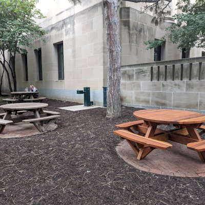Round Wooden Picnic Tables (Attached Benches) (Options: 5' Diameter, Attached Benches, California Redwood, Standard Tabletop, No Lazy Susan, No Umbrella Hole & Plug, Transparent Premium Sealant). Photo Also Shows 2 Old Round Picnic Tables. Photo Courtesy of J. Reeves of Kansas City, MO.