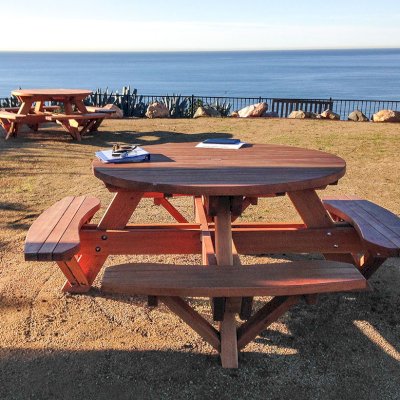 Round Wooden Picnic Tables (Attached Benches) (Options: 4 1/2' Diameter, Attached Benches, Douglas-fir, Standard Tabletop, No Lazy Susan, 2" Umbrella Hole & Plug, Transparent Premium Sealant). Photo Courtesy of Cynthia Hirschhorn of Pacific Palisades, CA.