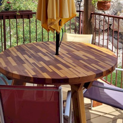 Round Wooden Picnic Tables (Detached Benches) (Options: 4 1/2' Diameter, No Seating, Mosaic Redwood, Round Picnic Bench, Parquet Tabletop, No Lazy Susan, 1 5/8" Umbrella Hole, Transparent Premium Sealant). Photo Courtesy of G. Flacke of Tucson, AZ.