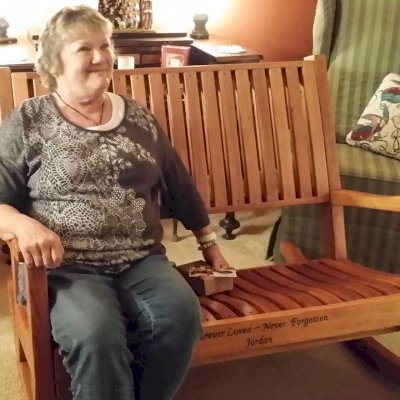 Ruth Redwood Rocking Bench (Options: Deep, Redwood, No Cushion, Custom Engraving, Transparent Premium Sealant). Photo Courtesy of Terri Stewart of Olathe, Kansas.