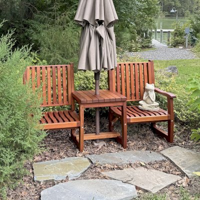 Ruth Vignette Wood Settee (Options: Mature Redwood, Slightly Rounded Corners, 2" Umbrella Hole, No Custom Cushion, Transparent Premium Sealant). Photo Courtesy of M. Kramer of Lottsburg, Va.