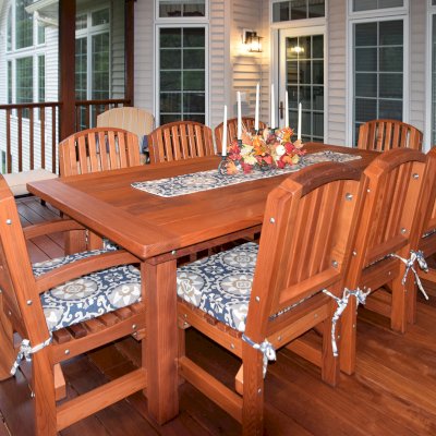 San Francisco Redwood Patio Table (Options: 8' L, 46" W Tabletop, Chairs, Mature Redwood, 8 Chairs, Luna Chair Design, 2 Armchairs & Side Chairs, Custom Cushions, Old Country Tabletop, Standard, Slightly Rounded Corners, No Umbrella Hole, Transparent Premium Sealant). Photo Courtesy of L. Chase of Pittsford, NY.