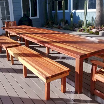 San Francisco Redwood Patio Table (Options: 16' L, 48" W Tabletop, California Redwood, Side Benches & End Chairs, Classic Picnic Benches, Ruth Chairs, Standard Tabletop, Squared Corners, 2 Half Length Benches Per Side, No Umbrella Hole, Transparent Premium Sealant). Photo Courtesy of K. Butler of Malibu, CA.