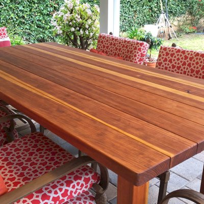 San Francisco Redwood Patio Table (Options: 7' L, 42" W Tabletop, California Redwood, No Seating [Photo Shows Customer's Chairs], Standard Tabletop, Slightly Rounded Corners, No Umbrella Hole, Transparent Premium Sealant). Photo Courtesy of Paul Oh of Agoura Hills, CA.