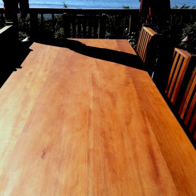 Seamless tabletop detail photo (Options: 8'L, 40 1/4" W Tabletop, Chairs, Old-Growth Redwood, Seamless Tabletop, 6 Chairs, Ruth, All Side Chairs, No Cushion, Squared Corners, No Umbrella Hole, Transparent Premium Sealant). 