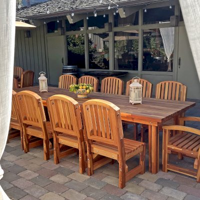 San Francisco Redwood Patio Table (Options: 12' L, 46" W Tabletop, Chairs, Mosaic Eco-Wood, 12 Chairs, Luna Chair Design, 2 Armchairs & Side Chairs, No Cushions, Standard Tabletop, Slightly Rounded Corners, No Umbrella Hole, Transparent Premium Sealant). Photo Courtesy of J. Newman of Carmel Valley, CA.