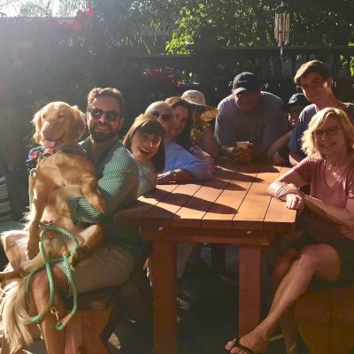 San Francisco Redwood Patio Table (Options: 8' L, 30" W Tabletop, Side Benches, California Redwood, Trestle Bench, 2 Half Length Benches Per Side, No Cushions, Standard Tabletop, Slightly Rounded Corners, No Umbrella Hole, Transparent Premium Sealant). Photo Courtesy of B. Wyrsch of Capitola, California.