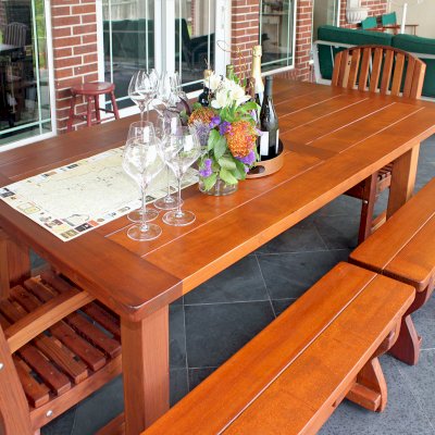 San Francisco Redwood Patio Table (Options: 7' L, 46" W Tabletop, Mature Redwood, Side Benches & End Chairs, Trestle Bench, Luna Chairs, Old Country Tabletop, Standard, Rounded Corners, 2 Half Length Benches Per Side, No Umbrella Hole, Transparent Premium Sealant). Photo Courtesy of D. Barry of Houston, Texas.