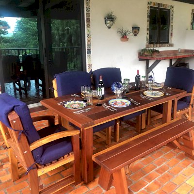 San Francisco Redwood Patio Table (Options: 6' L, 36" W Tabletop, Luna Chairs, California Redwood, End Chairs + 2 Side Chairs + 1 Full Legth Picnic Bench, Old-Country Tabletop - Standard, Slightly Rounded Corners, No Umbrella Hole, Transparent Premium Sealant). Photo Courtesy of D. Leman of Indian River Shores, Florida.